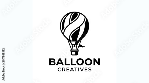 Tableau sur toile Hot air balloon soars over mountains with creatives nearby