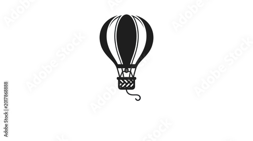 Bild auf Leinwand A hot air balloon floats gently in the sky with a basket underneath