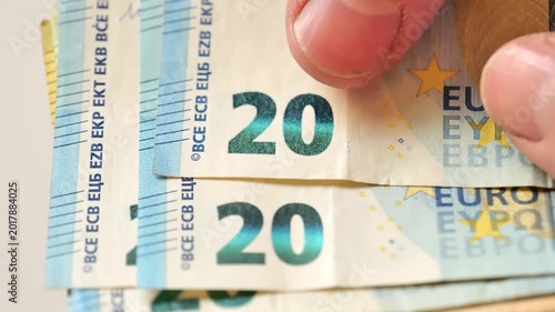 counting Euro Banknotes. Fingers sorting through Euro banknotes close-up.Daily Expenses in the European Union.