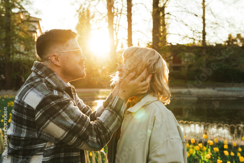 Konstfotografi Young couple embracing tenderly during a beautiful sunset, sharing a moment of r
