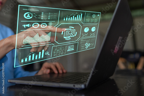 Business Data Analytics Specialist Using Virtual Reality Interface on Laptop Screen