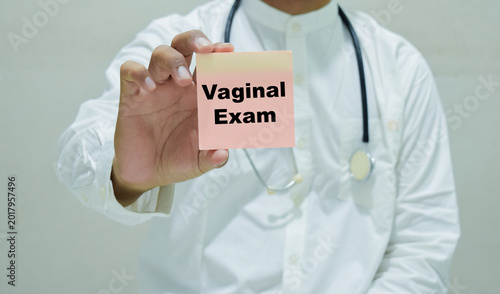 Doctor holds in hands a card with the name of the medical exam. Medical concept