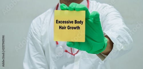 Canvastavla Doctor holds in hands a card with the name of the excessive body hair growth