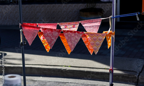 Fotografía Homemade pennants hanging at street fair