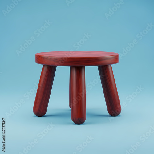 Wooden stool with three legs against a blue background studio shot isolated