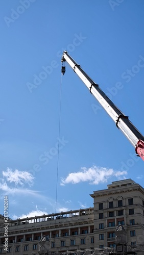 Canvas Print Moscow, Russia - April 25, 2026: Construction crane boom against the blue sky