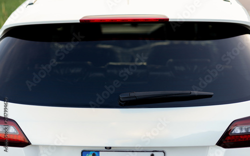 Close Up of Rear Wiper on Back Glass of White Crossover Vehicle