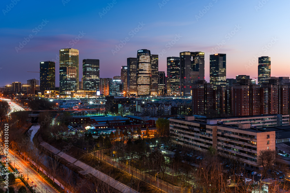 Naklejka premium Riverside urban night view of Beijing Lize Financial Business District