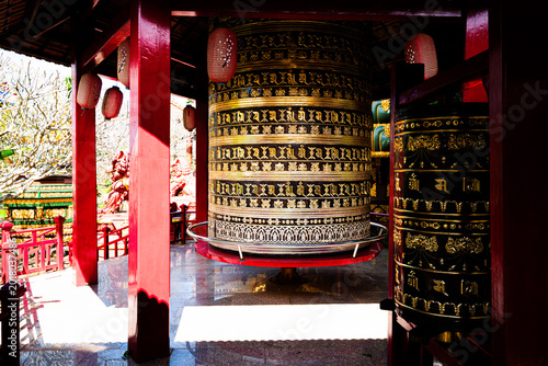 Konstfotografi Ornate golden prayer wheel detail Buu Minh Pagoda Pleiku Vietnam