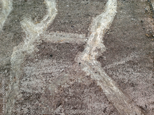 Foto Close up of weathered concrete surface with white mineral stains and rough gritt