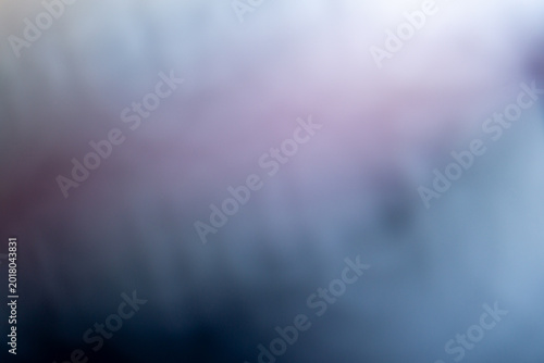 Soft abstract background with smooth gradients of pastel purple, muted blue, and white, creating a dreamy, blurred texture perfect for modern minimalist artistic designs.