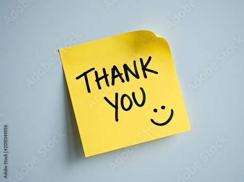 Yellow sticky note with handwritten 