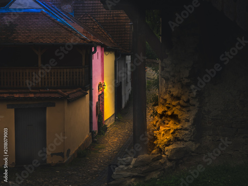 Fotografie Atmospheric medieval alley at dusk in Sighisoara Romania Dracula birthplace