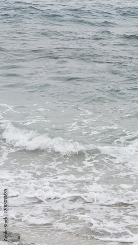 Gentle Ocean Waves Breaking on a White Sandy Beach