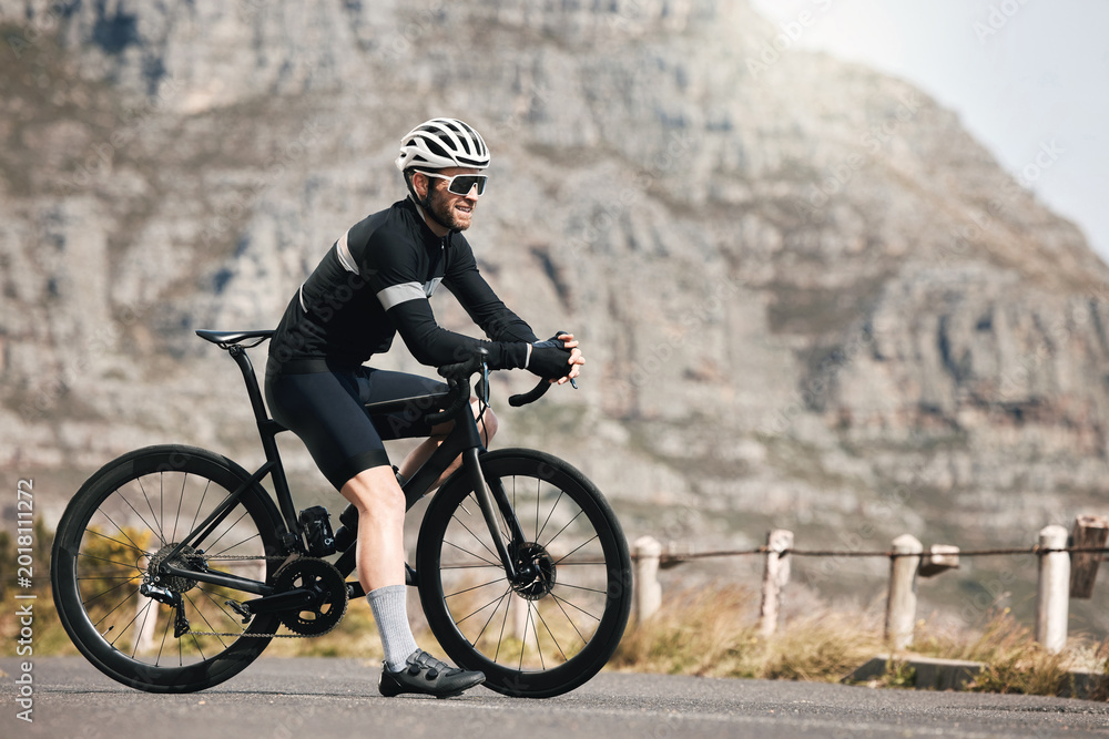 Obraz premium Thinking, man and cyclist with bicycle outdoor for fitness, exercise and endurance training. Mature person, vision and bike for workout challenge, cycling sports and triathlon competition in nature