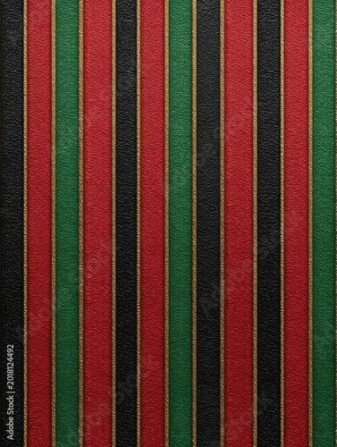 Juneteenth gift wrap texture, seamless pattern of red, black, and green stripes with subtle gold accents, fabric-like paper texture, and a vertical red, green, and black striped fabric background