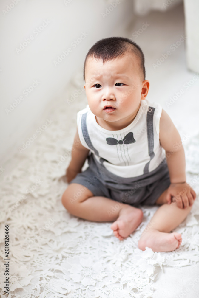 Fototapeta premium Cute Asian boy playing indoors