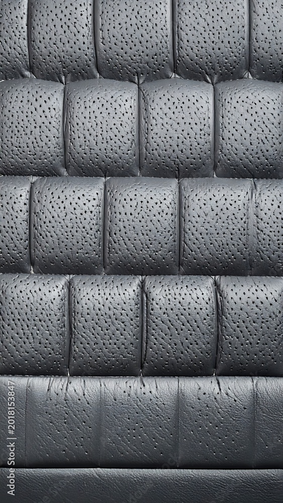 Fototapeta premium A close-up of a gray, quilted leather surface