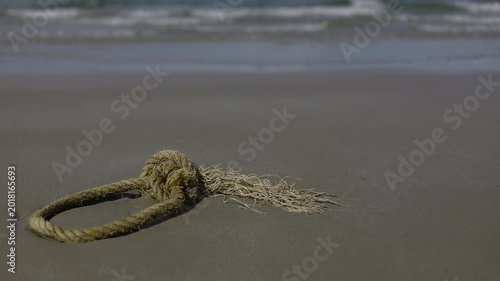 Broken Marine Rope Abandoned On The Sandy Beach