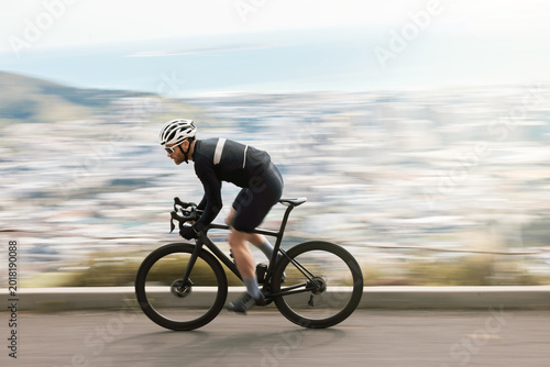 Fotografie Fitness, bike or cyclist outdoor with motion blur, endurance training or speed in cardio workout