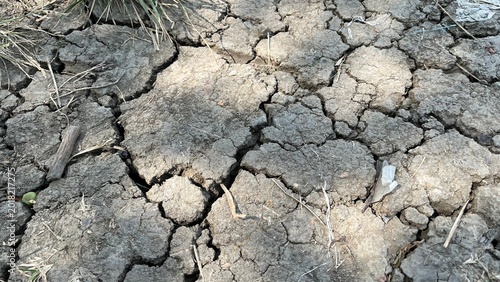 Photos Top View of Dry Cracked Earth Texture with Sunlight Shading