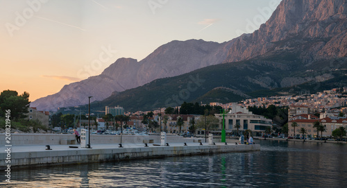 Картината върху платно A Panoramic View of Makarska and the Biokovo Mountain Range at Sunset