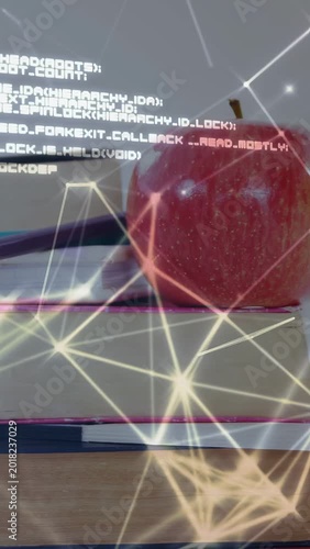 Vertical video: Camera panning right, books pencils apple entering as overlay growing to show code