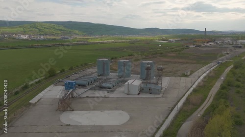 Aerial View of Industrial Storage Facility and Factory Tanks in Countryside landscape