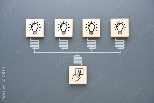 Foto Single switch activating multiple light bulb icons connected in a network, repre
