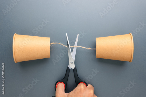 Communication breakdown and loss of connection concept with cut string phone