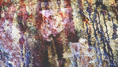 Rugged earthy texture with intense violet and ochre mineral veins