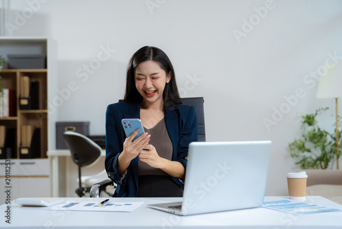 Photos Overjoyed charming excited woman business woman worker using smartphone