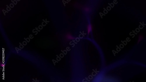 Cinematic soft focus purple and blue plasma energy filaments flickering gently in a dark environment creating a diffuse ethereal glowing background for science projects.