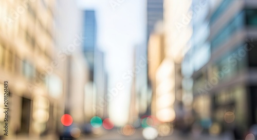 Dreamy defocused view of a modern city street with bright bokeh lights.