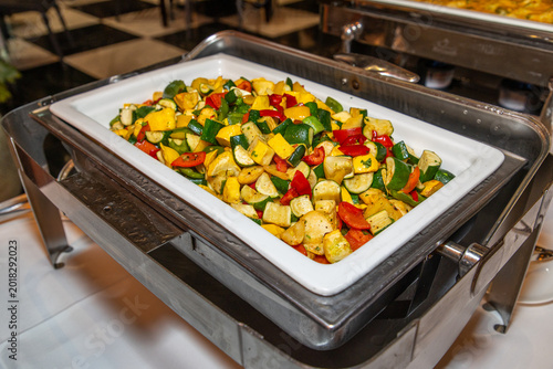 Valokuva A medley of roasted vegetables, potatoes, marrows, peppers and patty-pans,