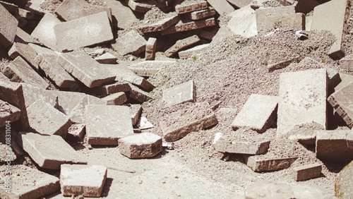 Slika na platnu A large pile of broken and intact stone paving slabs mixed with rubble and sand