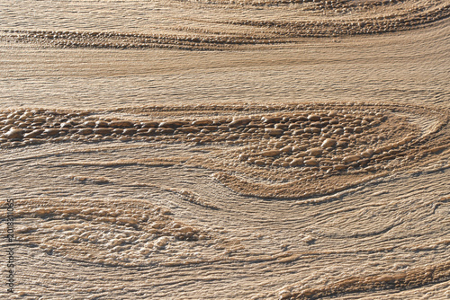 Photography Close-up of Water Surface Foam and Layered Mineral Texture