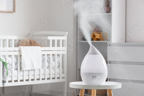 Air humidifier on table in ...