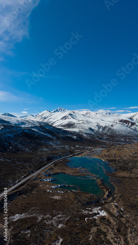 Frozen Sister Lakes in Tibet During Winter, Scenic Alpine Landscape in Western China