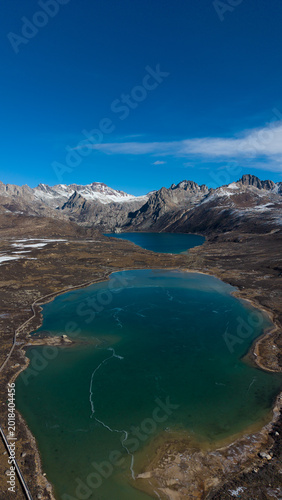 Frozen Sister Lakes in Tibet During Winter, Scenic Alpine Landscape in Western China