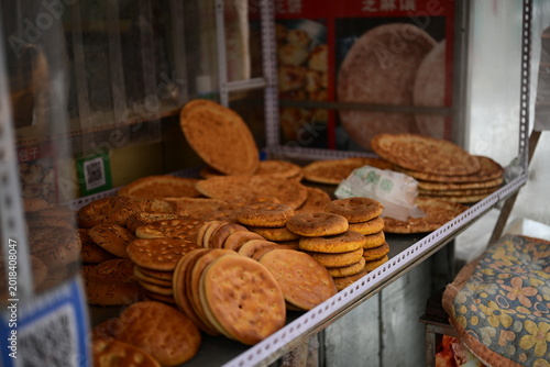 treet Scene in Urumqi Xinjiang with People’s Cinema and Traditional Nang Bakery, Uyghur Cultural Life