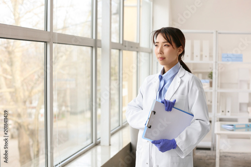 Female Asian doctor with cl...