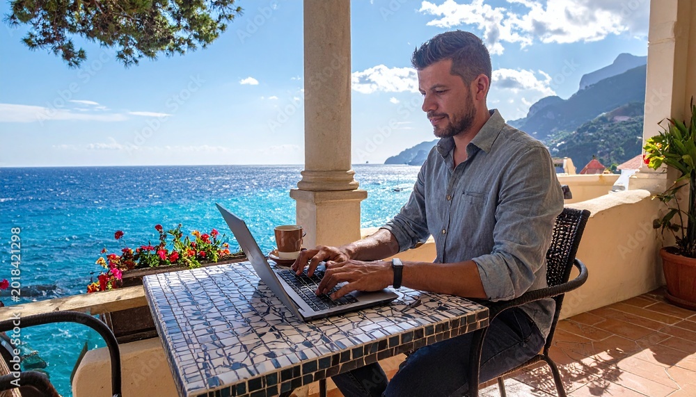Naklejka premium Focused professional enjoying remote work from a stunning coastal terrace with ocean views. Perfect for representing travel, business lifestyle, freedom, and the modern digital nomad life.