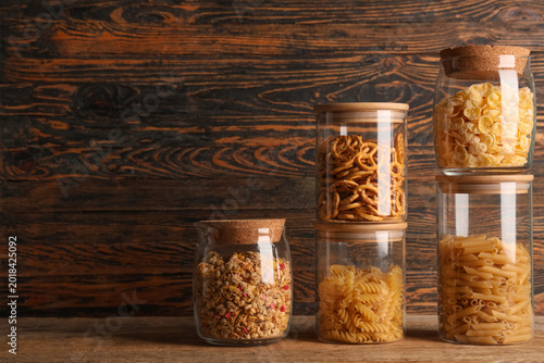 Many glass jars with differ...