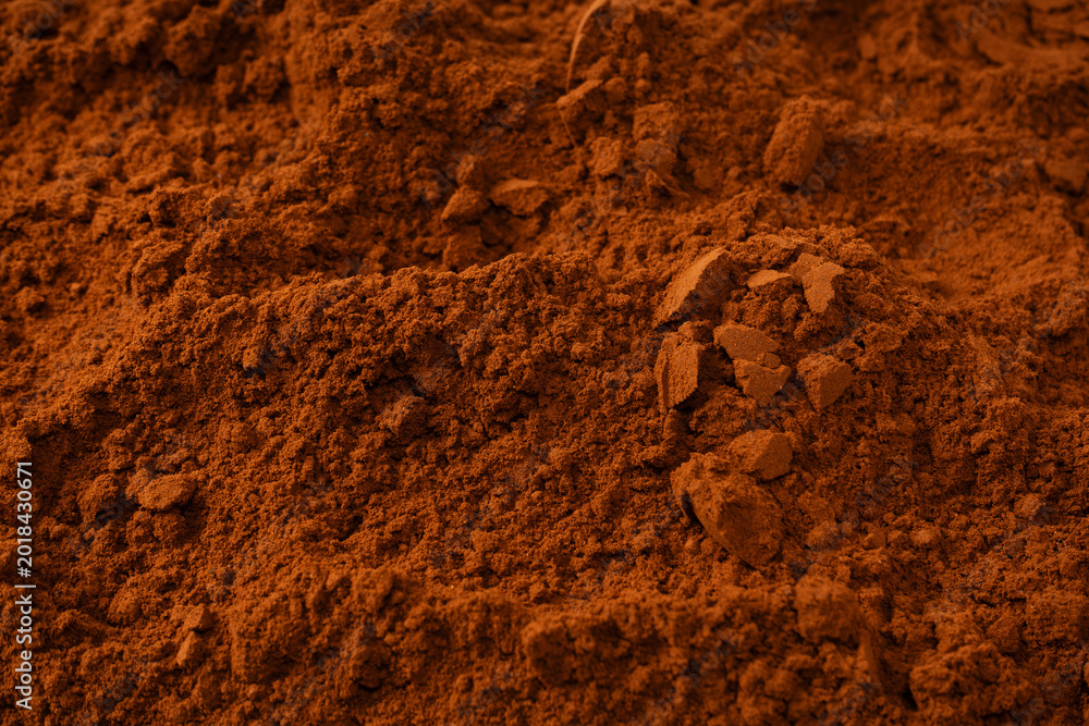 Fototapeta premium Cocoa powder as a background. Top view.