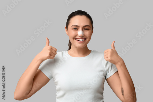 Happy young woman with band...