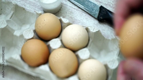 takes a few eggs from the package
