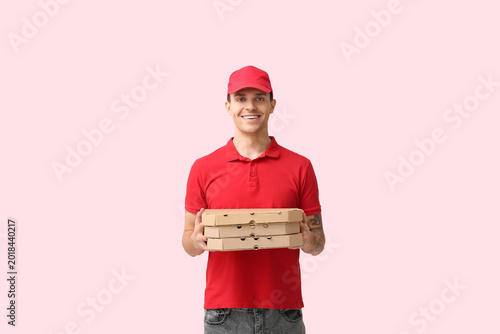 Delivery man holding cardbo...