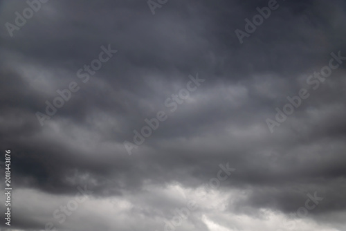 Tableau sur toile Dark storm clouds gathering over an overcast sky before heavy rain and an approa