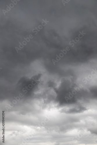 Photography Dark storm clouds gathering in an overcast sky creating a dramatic, moody and fo